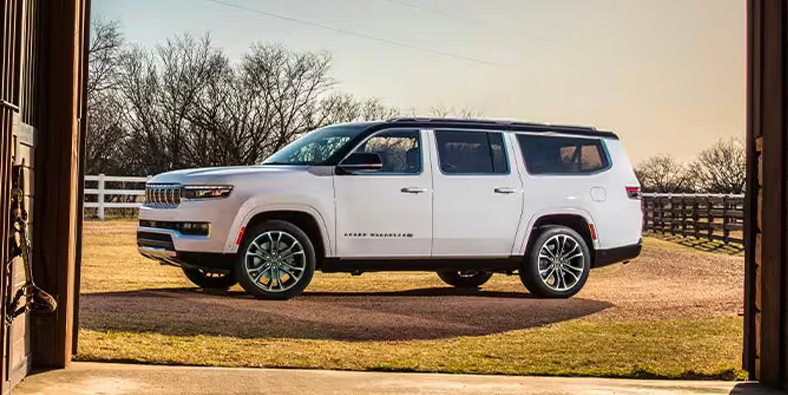 A 2025 Jeep Grand Wagoneer parked on a farm.