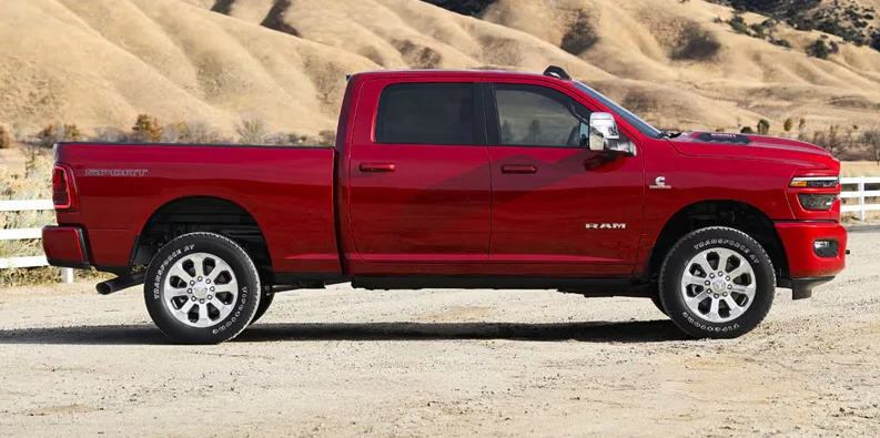 A 2026 RAM 2500 parked on a dirt road.